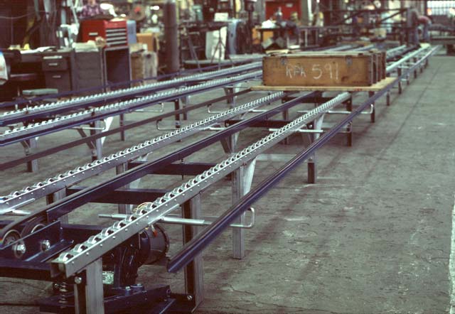 Here a Zipflo drives a pallet while using skate wheel conveyor rails to help support the load.