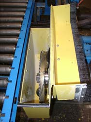 Here you can see the ripping saw blade lowered inside the dust removal housing with the safety lid open. Click to enlarge.