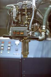 Shown in this picture is the mixing and dispensing head that is suspended from a boom.