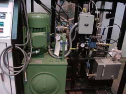Here is the hydraulic power unit in green, used to power the mixing head.