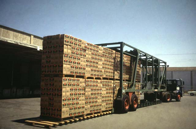 The driver backs over the pallets, lifts them and starts on his way to deliver them all in two minutes.