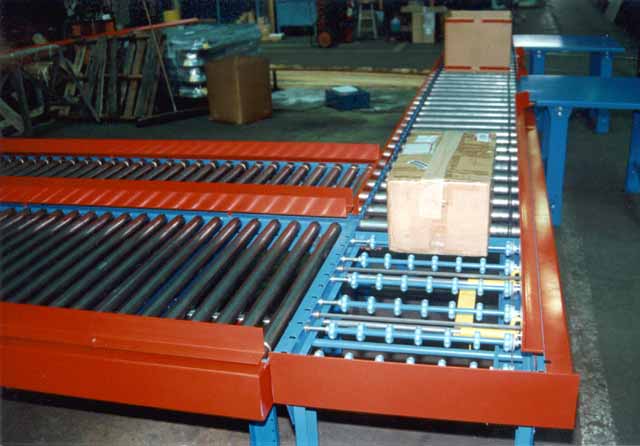 The powered roller put the package onto the Transwheel transfer table where it is pushed onto the next section.