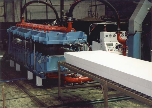 This custom machine, built by Kornylak for a customer, fabricates polystyrene structural insulated paneling.